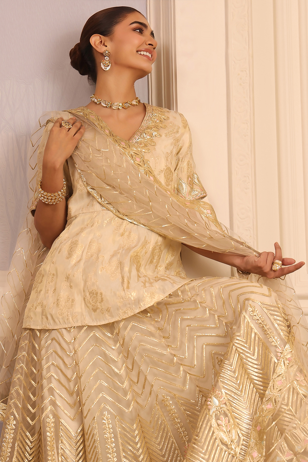 Beige Embroidered Peplum Lehenga Set image number 1